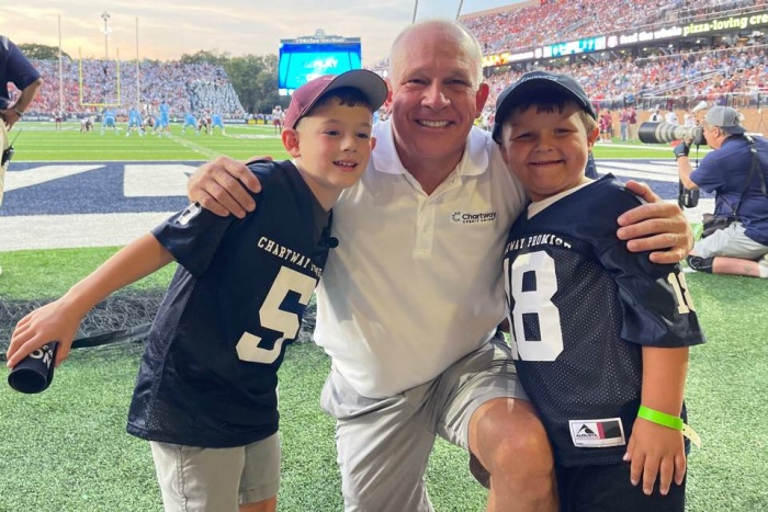 Cameron and Foster enjoyed watching the first quarter of the game on the field with Brian Schools Chartway president & CEO as they prepared for their on-field wish reveal
