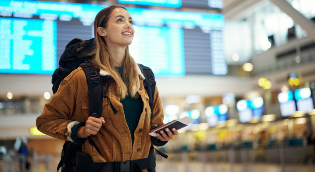Travel, airport and excited woman with passport. travel ticket and documents for immigration, journey and flight schedule. Backpack person with identity document search for international registration.